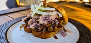 Pulled Pork Barbecue SandwichesWith Spicy Slaw, Fresh Onions, and Pickles on Buttered Toast